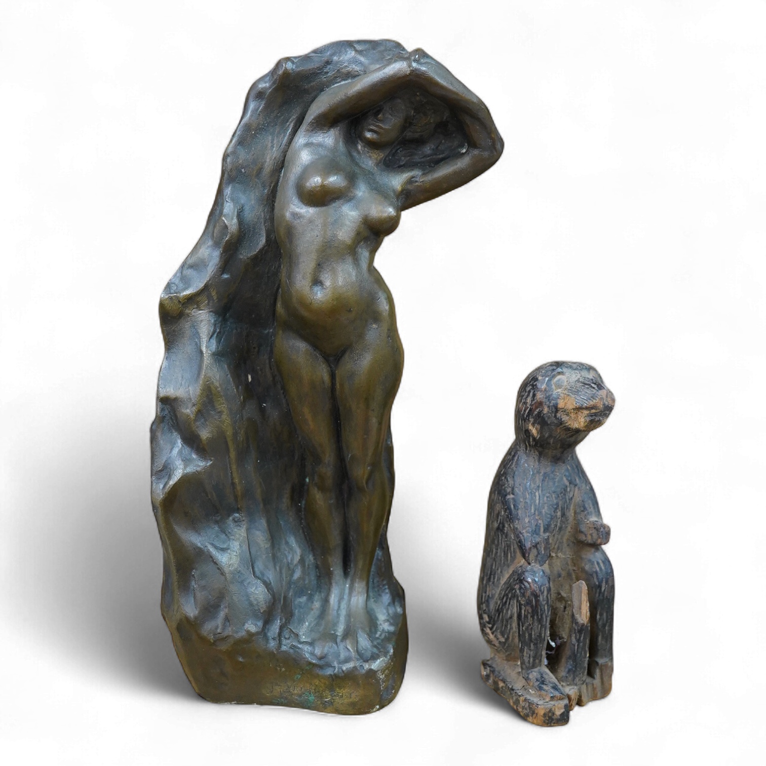 A contemporary bronze figure of a standing female nude, indistinctly signed and a card wood figure of a bear, tallest 29.5cm